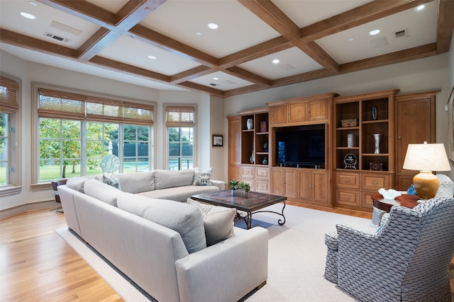 living room featuring beam ceiling, coffered ceiling, and light wood-type flooring