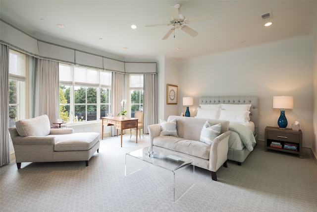 bedroom with carpet, multiple windows, and ceiling fan