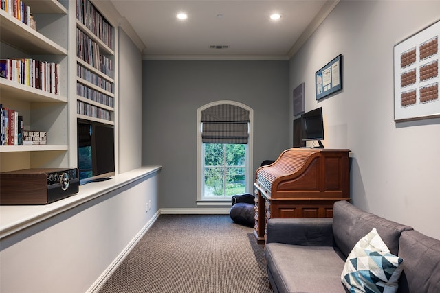 living area with carpet flooring and crown molding