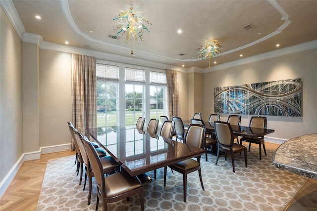 dining space featuring crown molding and parquet flooring