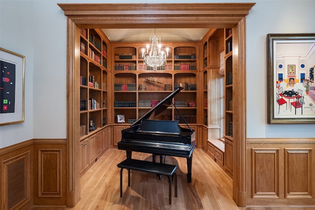 misc room with an inviting chandelier and light wood-type flooring