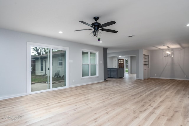 unfurnished living room featuring light hardwood / wood-style flooring, plenty of natural light, and ceiling fan