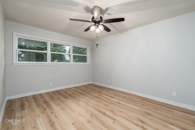 unfurnished room with light wood-type flooring and ceiling fan