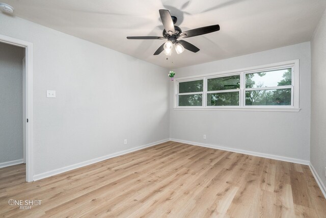 spare room featuring ceiling fan and light hardwood / wood-style floors