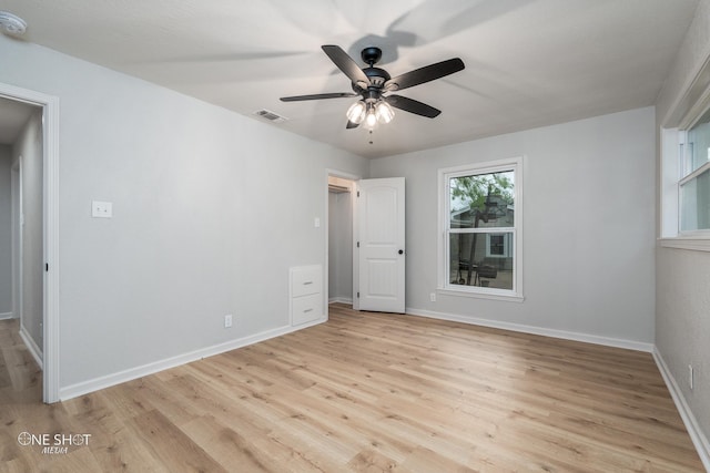 spare room featuring ceiling fan and light hardwood / wood-style flooring