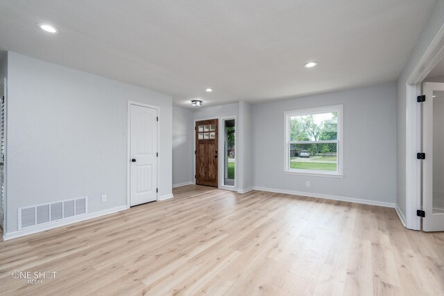 empty room with light wood-type flooring