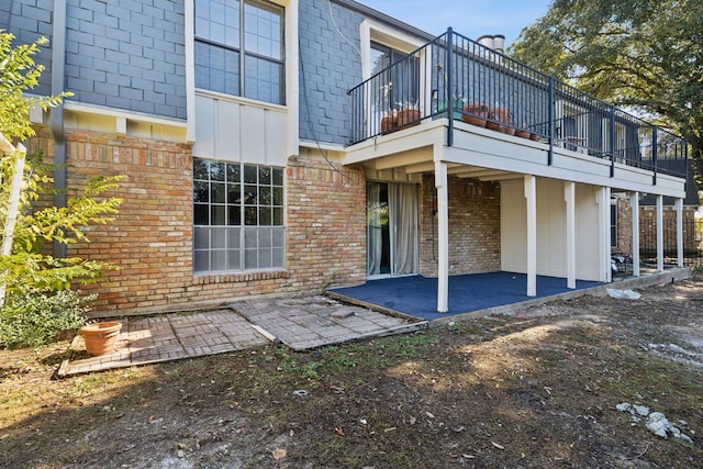 rear view of house featuring a patio