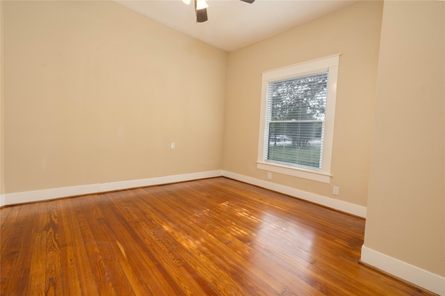 unfurnished room featuring hardwood / wood-style flooring and ceiling fan