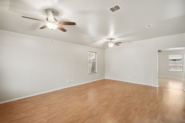 unfurnished room with light hardwood / wood-style flooring and ceiling fan