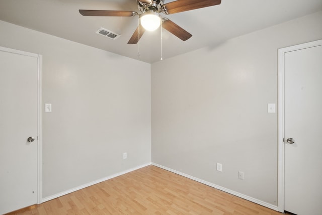 spare room featuring ceiling fan and light hardwood / wood-style flooring