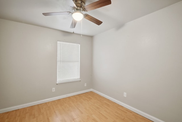 empty room with ceiling fan and light hardwood / wood-style flooring