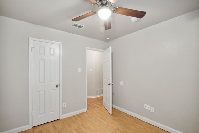 unfurnished bedroom with light hardwood / wood-style flooring and ceiling fan