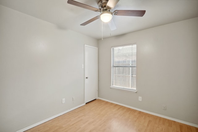 spare room featuring ceiling fan and light hardwood / wood-style flooring