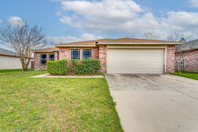 ranch-style home featuring a garage and a front lawn