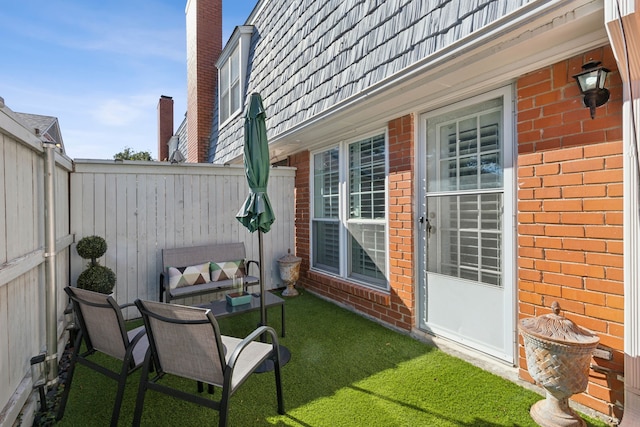 view of patio / terrace featuring fence