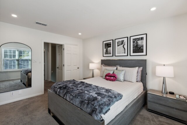 bedroom featuring carpet and ensuite bath