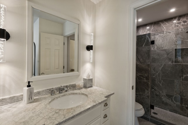 full bathroom featuring vanity, a marble finish shower, toilet, and recessed lighting