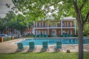 view of pool with central AC unit