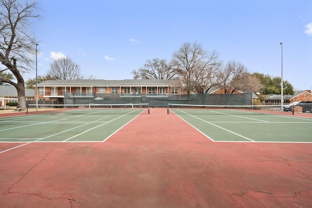 view of tennis court featuring basketball court