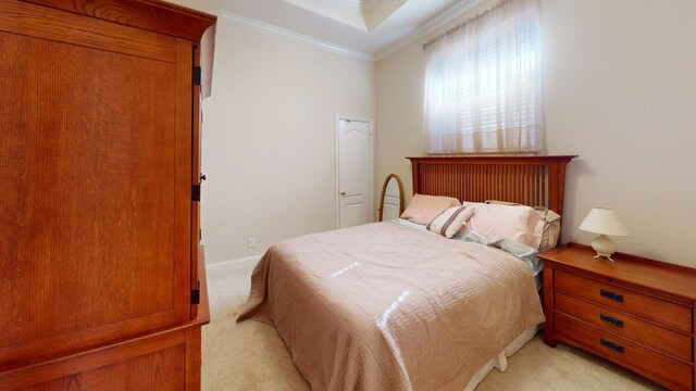 carpeted bedroom featuring crown molding