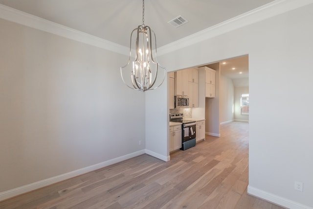 unfurnished dining area with light wood-type flooring, an inviting chandelier, and crown molding