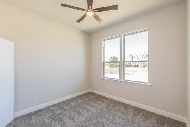 carpeted empty room with ceiling fan