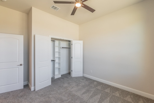 unfurnished bedroom with carpet flooring, ceiling fan, and a closet