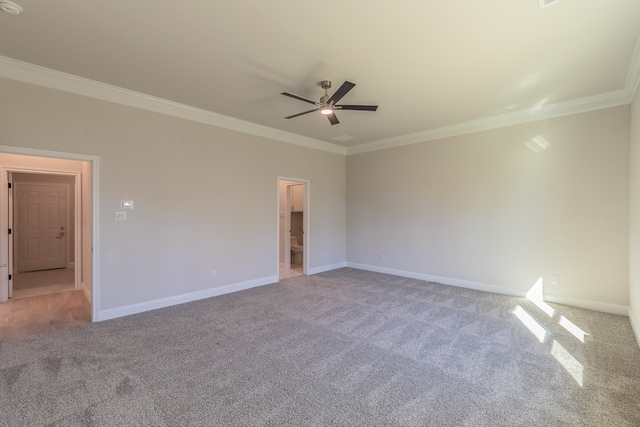 carpeted empty room featuring ceiling fan and ornamental molding