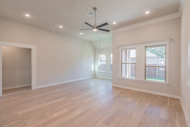 unfurnished room featuring ceiling fan with notable chandelier, light hardwood / wood-style floors, and crown molding