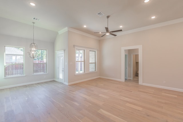 unfurnished living room featuring lofted ceiling, ceiling fan with notable chandelier, light hardwood / wood-style flooring, and ornamental molding