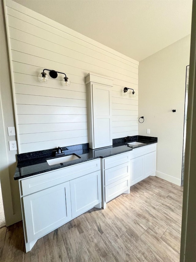 bathroom featuring sink and hardwood / wood-style floors