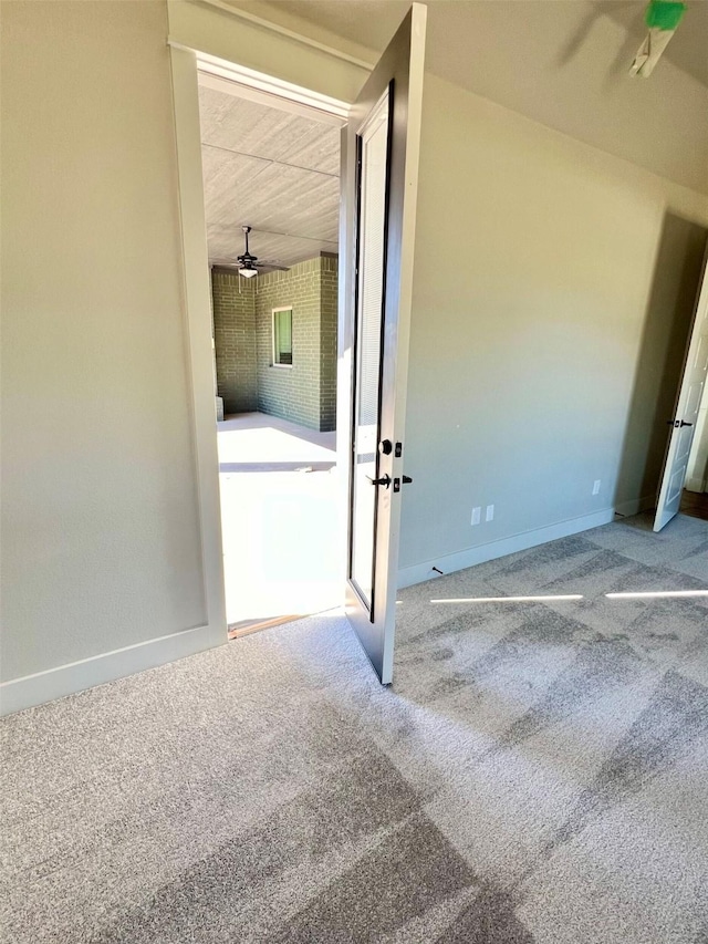 carpeted empty room with ceiling fan