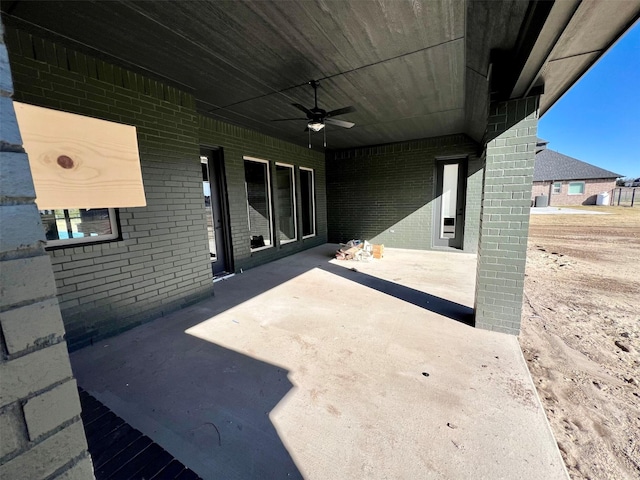 view of patio featuring ceiling fan