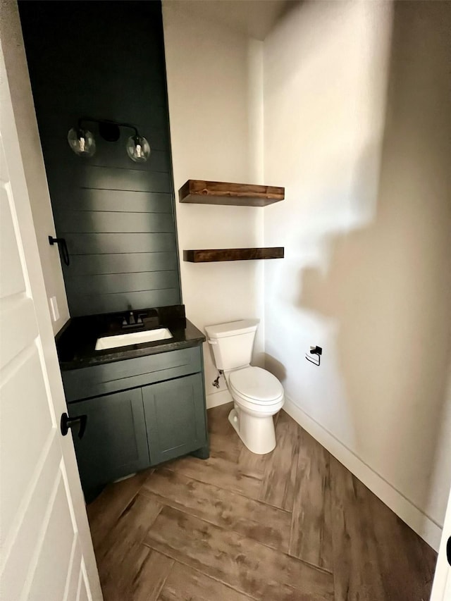 bathroom with toilet and vanity