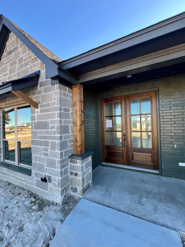 property entrance featuring french doors