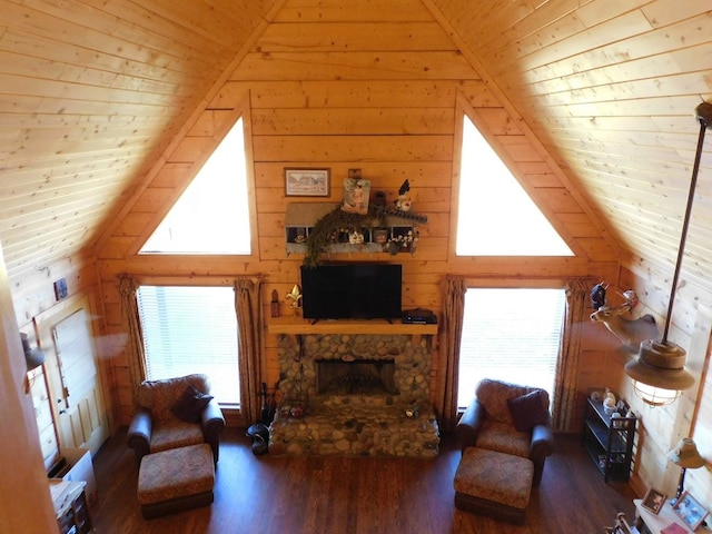 living room with dark hardwood / wood-style floors, wood ceiling, a healthy amount of sunlight, and wood walls