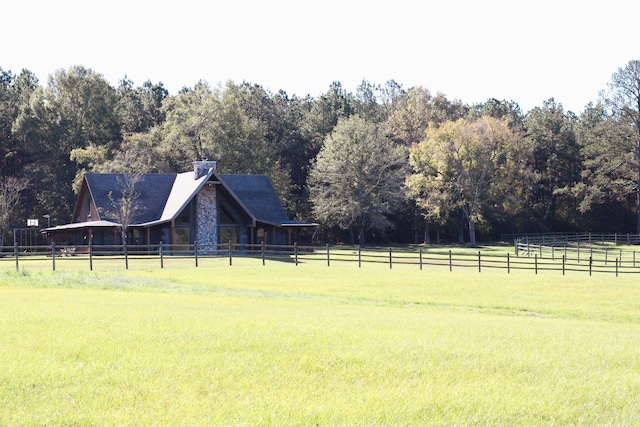 view of yard with a rural view