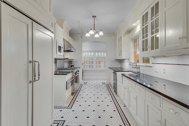 kitchen with white cabinets, decorative light fixtures, dishwasher, and crown molding