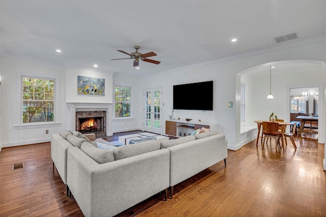 bedroom featuring hardwood / wood-style flooring, ceiling fan, and ornamental molding