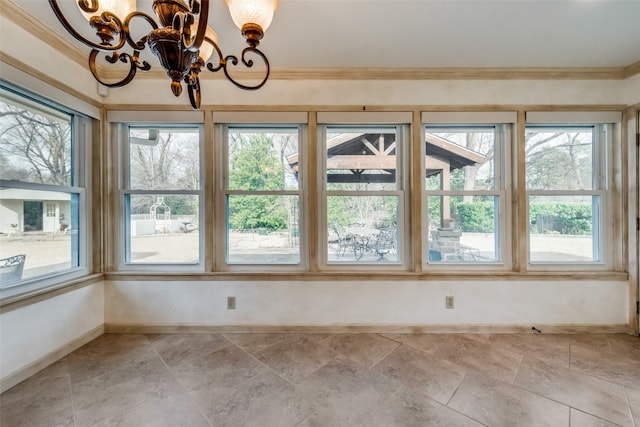 unfurnished sunroom with a notable chandelier and a wealth of natural light