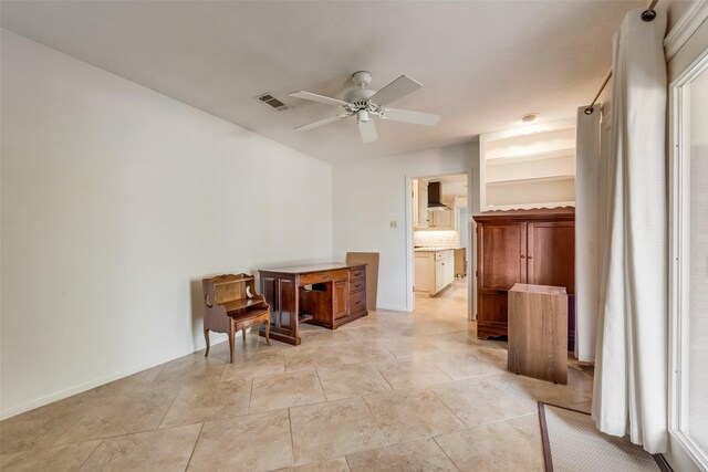 interior space featuring ceiling fan