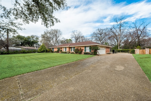 single story home with a front yard and a garage