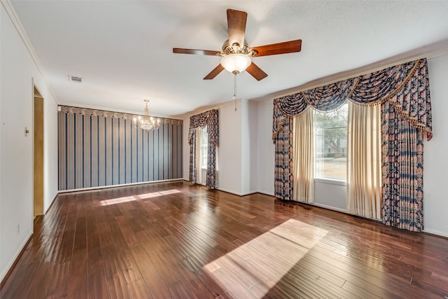 empty room featuring a textured ceiling, crown molding, wood-type flooring, and ceiling fan with notable chandelier