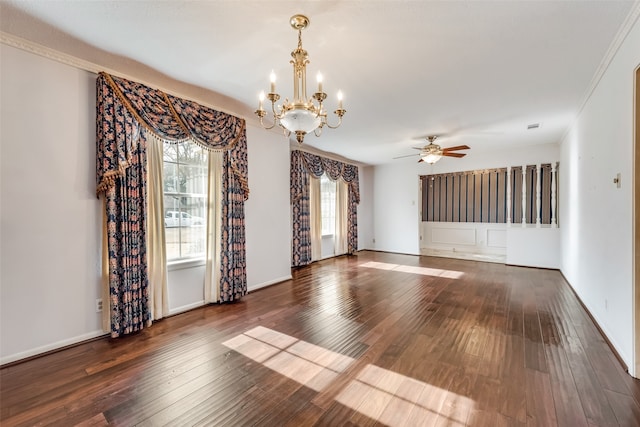 unfurnished room featuring ceiling fan with notable chandelier, dark hardwood / wood-style floors, and ornamental molding