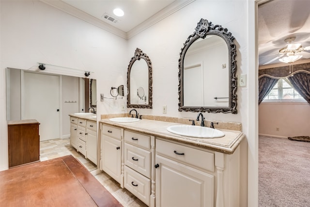 bathroom featuring vanity, ceiling fan, and crown molding