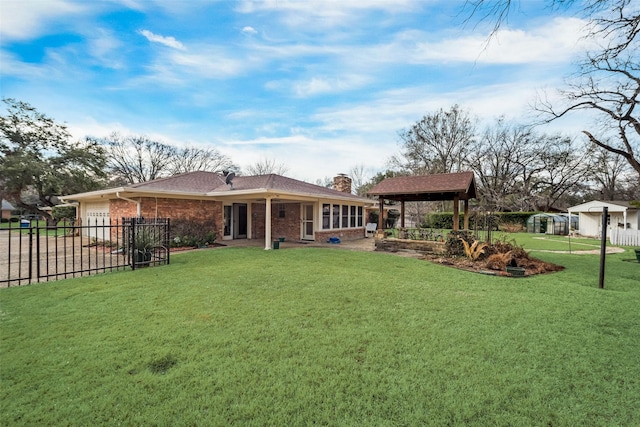 view of yard featuring a gazebo and a garage