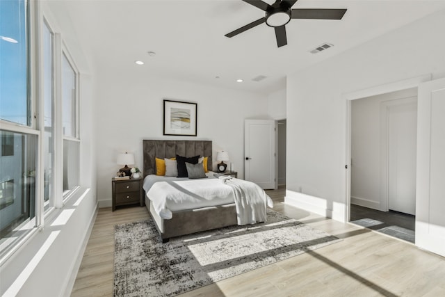 bedroom with ceiling fan and wood-type flooring