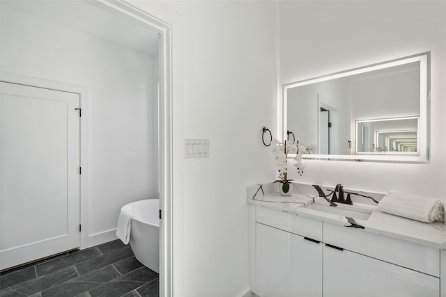 bathroom featuring a bathing tub and vanity