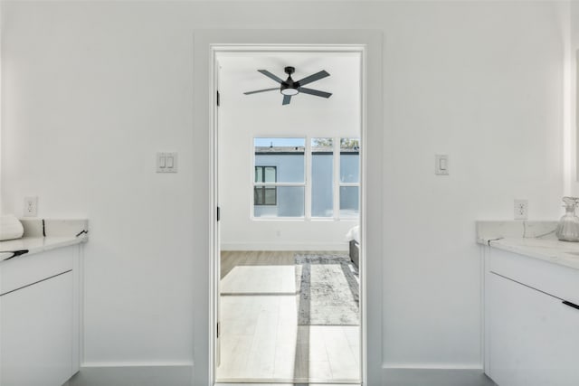 bathroom featuring hardwood / wood-style floors and ceiling fan