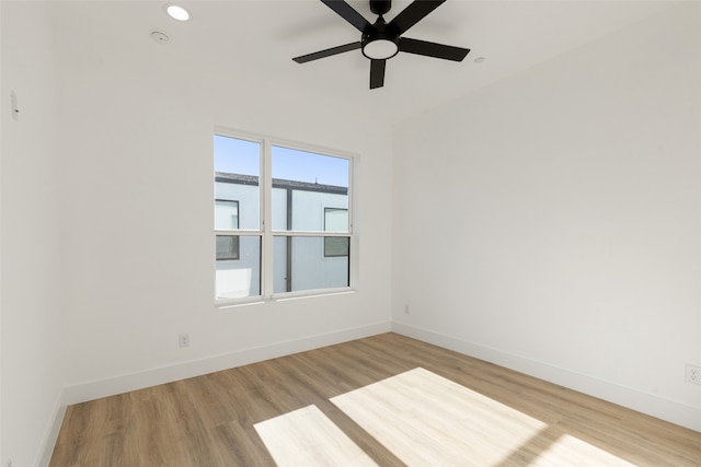 unfurnished room featuring ceiling fan and wood-type flooring